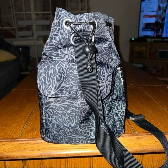 Baggallini Drawstring Bucket Crossbody Bag in Midnight Blossom - Picture 2 of 8